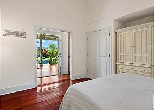 French doors open to the pool area