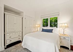 Queen bed with TV in hutch