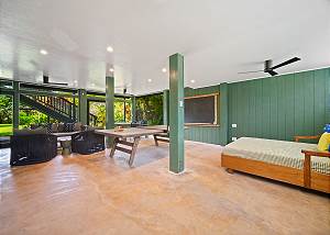 The downstairs fun room features a ping pong table and lots of s