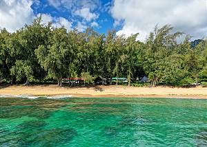 Golden sands and calm waters await