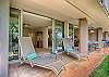 Shaded lanai with comfortable seating for morning coffee or sunset relaxation.
