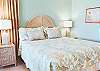 Bright and airy bedroom with plush bedding