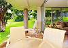 Outdoor lanai dining with tropical breezes.
