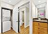 Clean, modern vanity area with upgraded countertop and lighting.