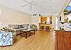 Open living space with comfortable seating, ideal for family gatherings or relaxing after a beach day.
