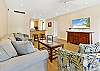 Secondary living-room perspective featuring cozy seating and décor.