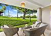 Relaxing outdoor seating area overlooking the lush Ka?anapali Golf Course and swaying palm trees.