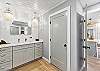 Beautifully remodeled bathroom featuring a spacious walk-in shower and a large double-sink vanity with modern fixtures.