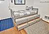 view of trundle bed with second bed and storage drawers exposed