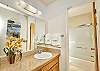 view of the downstairs vanity area with a peek in to the bathroom