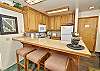 view of kitchen and counter with stools