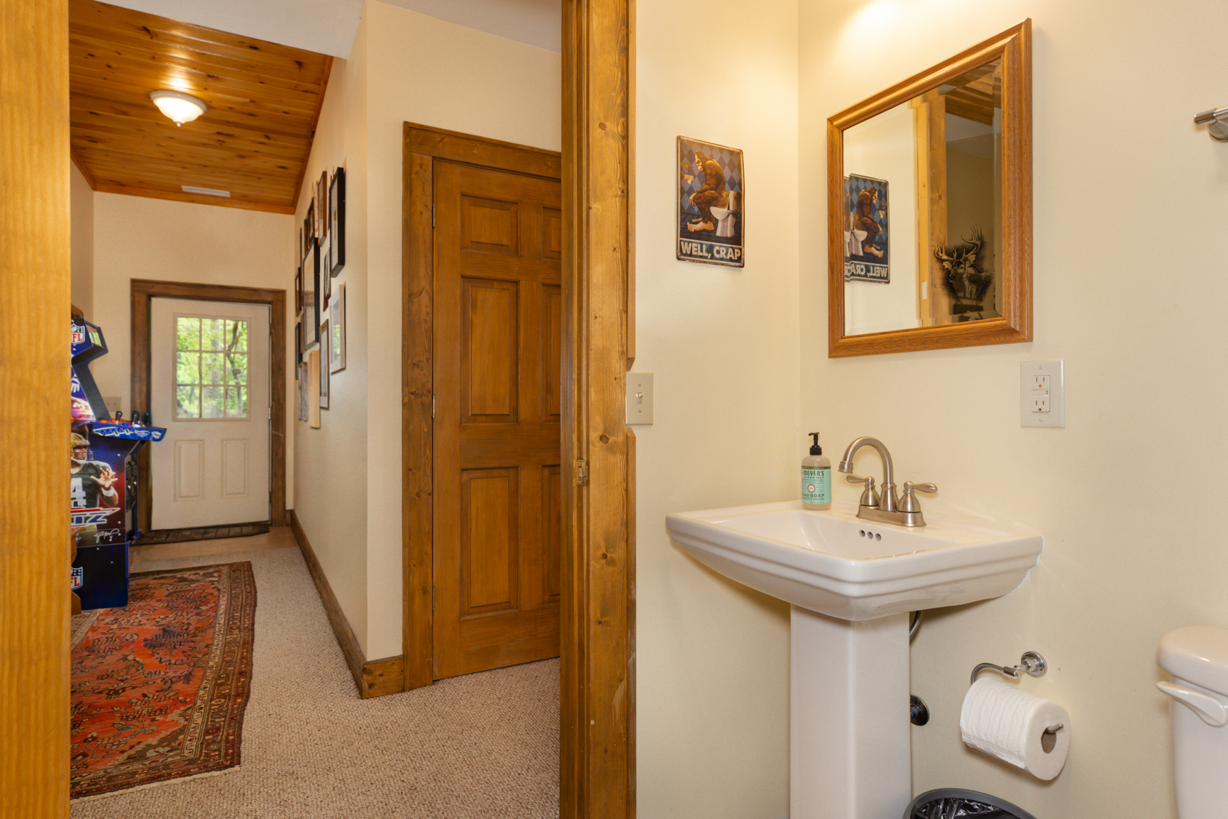Basement Bathroom view to hall to exterior door