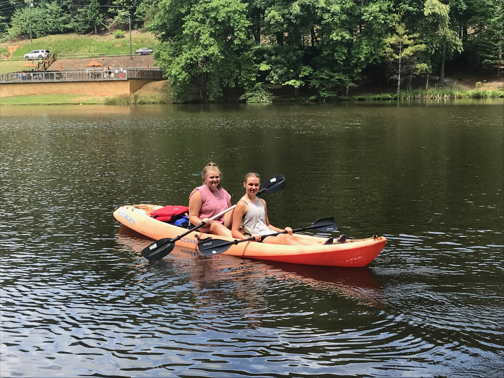 2 person sit on kayak