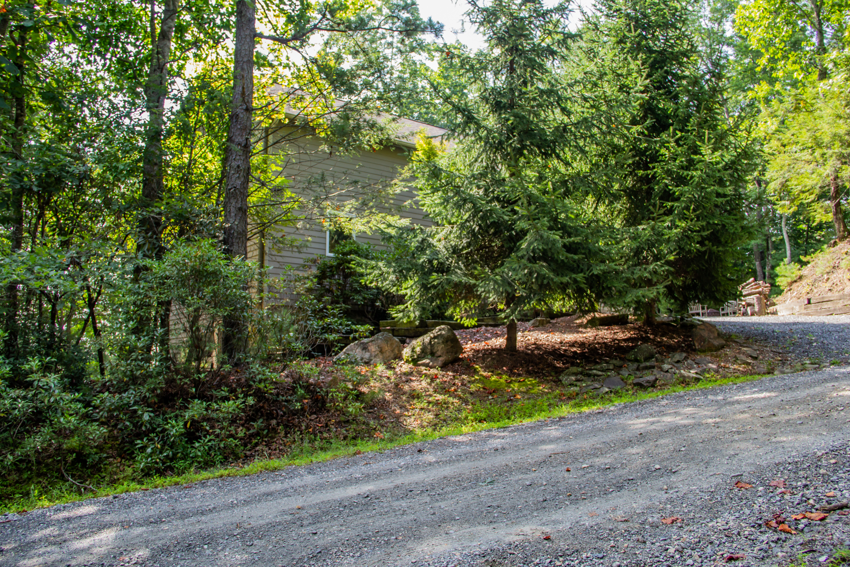 Road to house is gravel but main road is paved