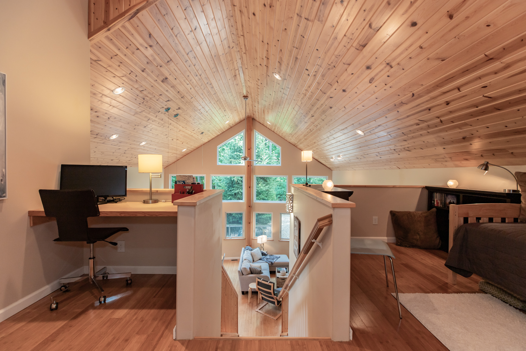 Both sides of loft showing desk and bed