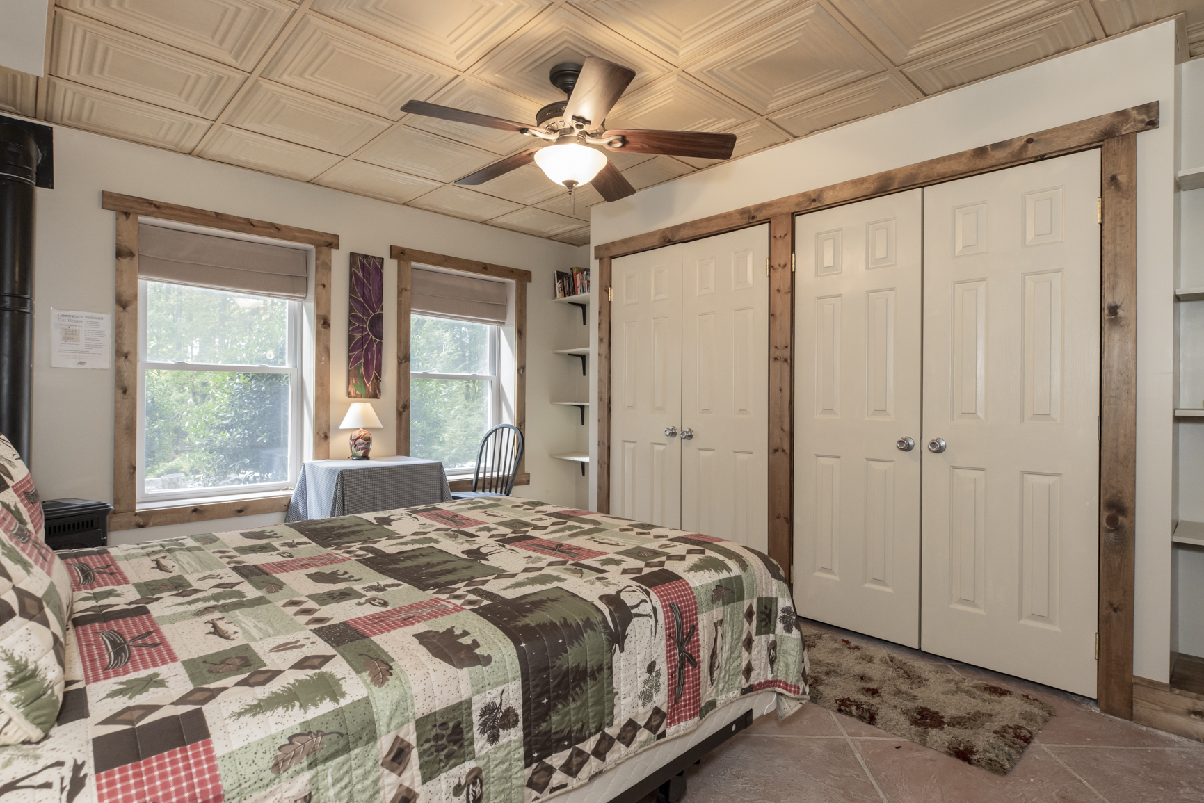 Basement level queen bedroom enclosed