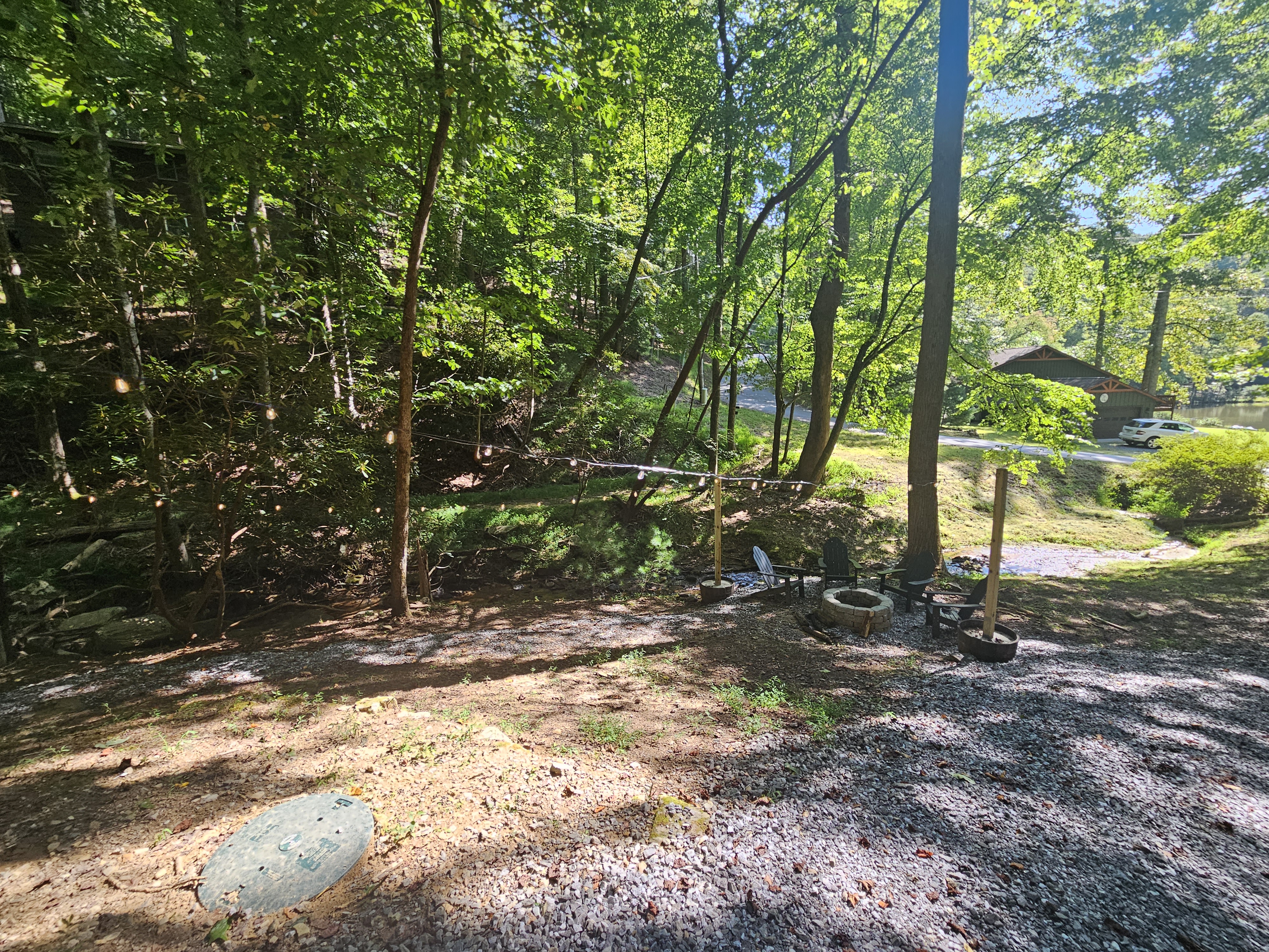 Fire Pit with Twinkle Lights by the creek!