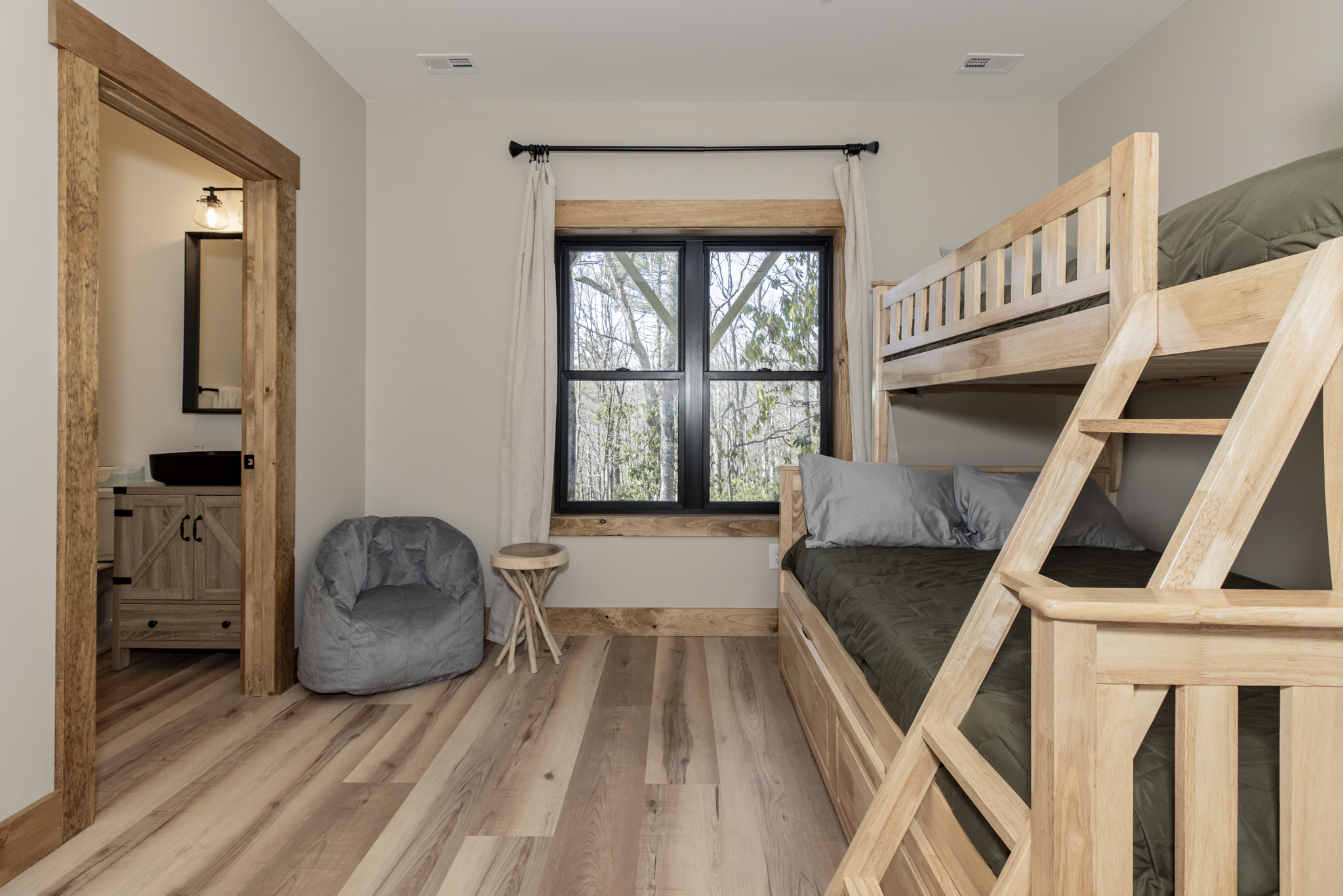 Basement level bunk toom with ensuite bathroom