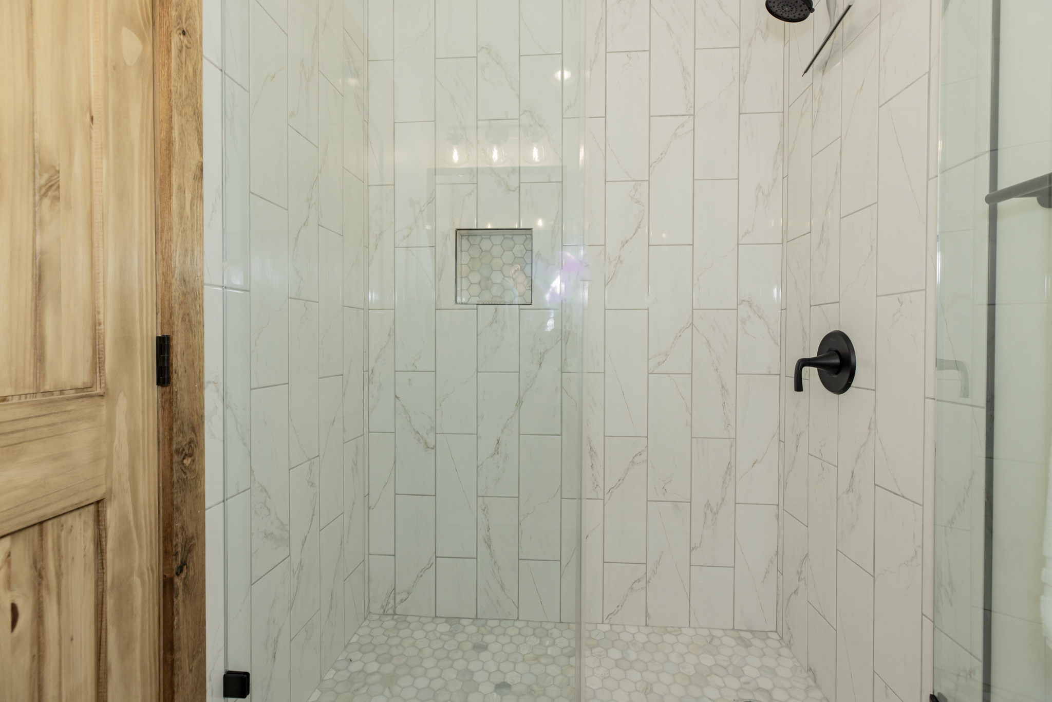 Basement bunk room ensuite bathroom with walk in shower