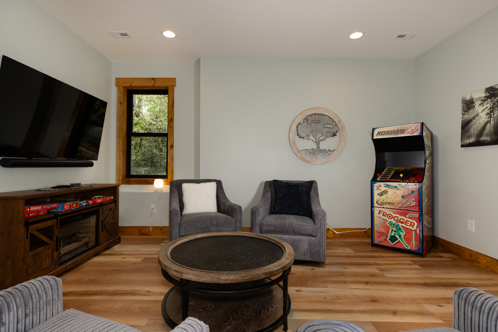 Basement level living room with TV , Games, Archade