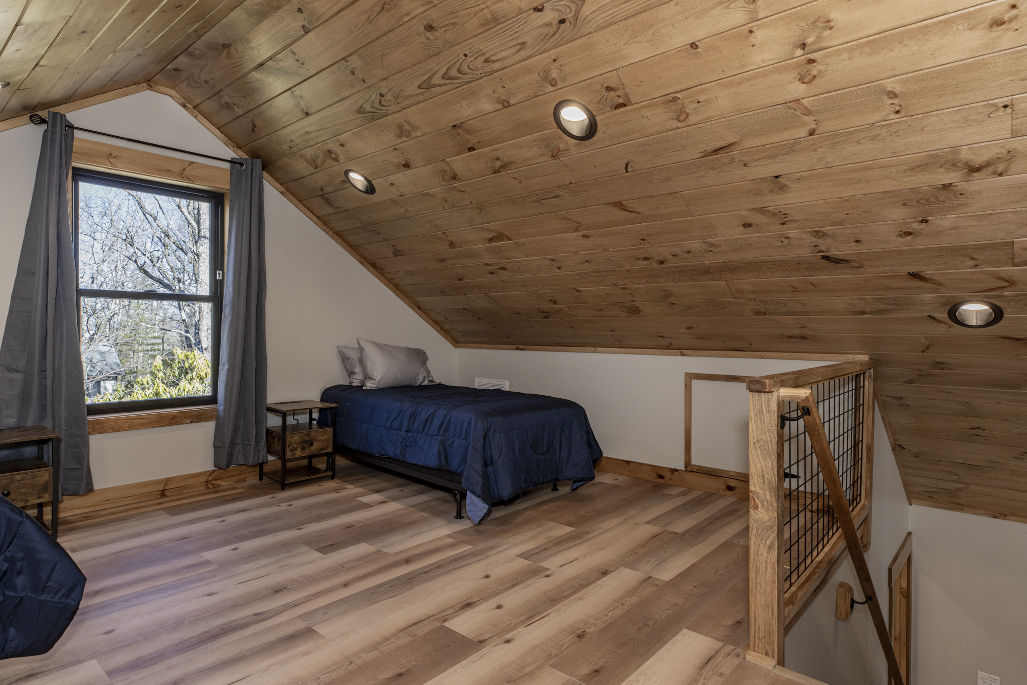 View of stairs from loft to main floor
