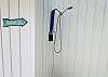 Exterior shower located on ground deck 