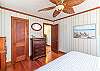 Gorgeous wood floors and doors, what a classic cottage! King size bedroom.