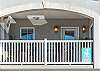 The Balcony overlooks some of the streets and lanes of Main Street Tybee Island.   Seating and table to relax and enjoy 
