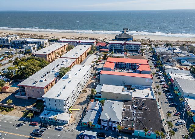 Yellow arrow in photo shows location of condo. Ocean block, easy walk to everything- beach , fishing pier, downtown Tybee Shops and Restaurants. 