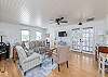 Living room. Comfortable sofa and chairs. Original wood floors.  
