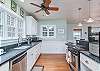 Soapstone counter tops with beautiful stainless appliances. Stay cool with your ceiling fan while in the kitchen.