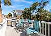 Upstairs sun deck with grill and seating.