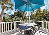 Upstairs sun deck with grill and seating.