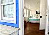 View into Bedroom #3 queen bedroom from screened porch.