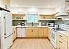 Beautiful open and airy kitchen - completely remodeled summer 2025!  This kitchen is fully stocked and so easy to get around. You'll love it as much as we do! 