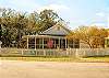 Great fenced yard and the screened porch of Enlisted Men's Mess Hall. On a super quiet street. We love this location. 