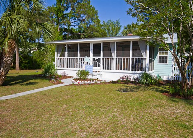 View of front of cottage and screened porch.