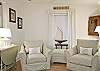 Slipcovered chairs in living room.  Beachy, neutral colors!