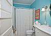 The 2nd full bathroom has a shower tub combination