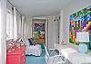 The enclosed back porch is now heated and cooled space.  This area also includes the twin bedroom nook.  A wonderful place to sleep , read and dream the afternoon away!
