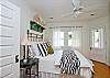 The master bedroom includes the queen bed, master bedroom, sitting area and also acess to screened porch.