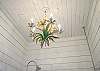 Chandelier in full bathroom.