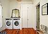 Laundry area behind kitchen.