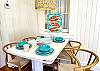 The dining area in has seating for 4 with its quirky and coastal vibes.  Great place to gather for meals, conversations, and even games.
