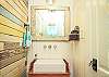 Half bath with awesome vintage wood wall!