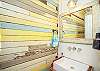 Half bath with awesome vintage wood wall!
