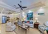Spacious open-concept living room with 60” Smart TV