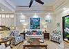 Spacious open-concept living room with 60” Smart TV