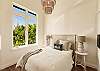 Breezy front bedroom with palm tree views
