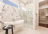 Soaking tub and rainfall shower head 